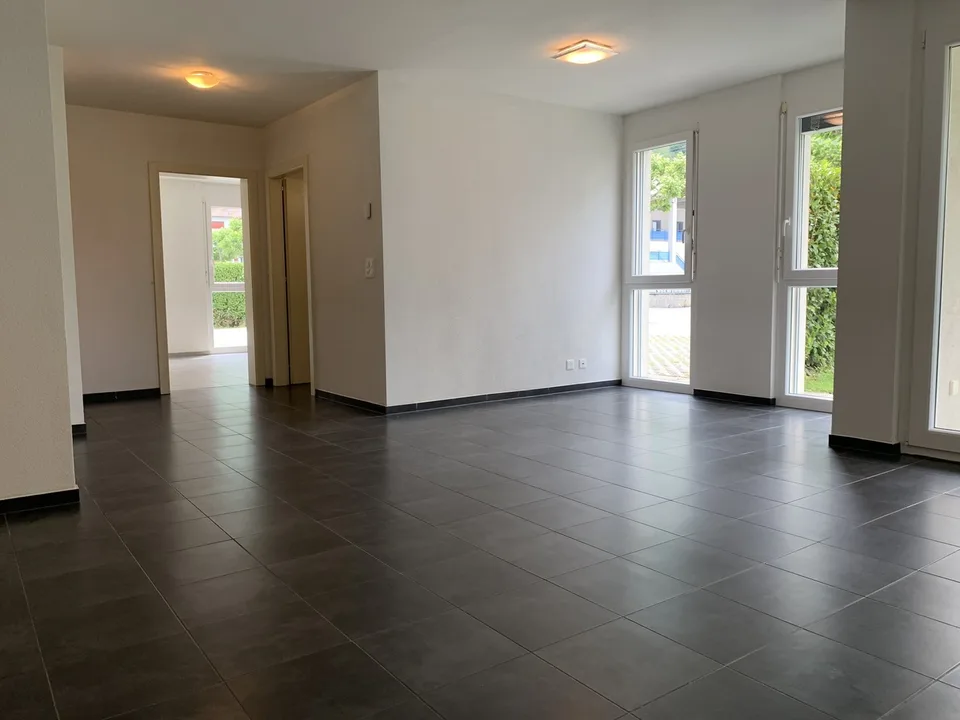 Appartamento di 2,5 locali al pianterreno con terrazza e giardino