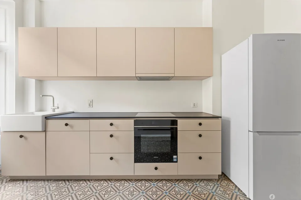 Appartamento di vecchio edificio ristrutturato con stile e giardino privato in posizione centrale a Biel