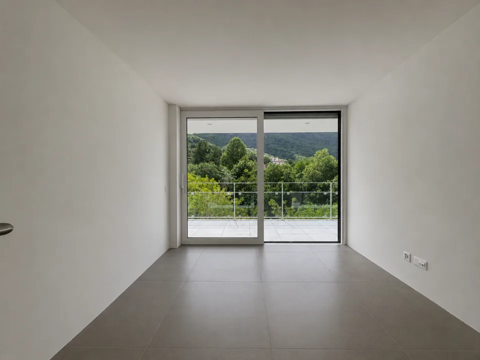 Appartamento con terrazza e splendida vista su Lugano e le montagne