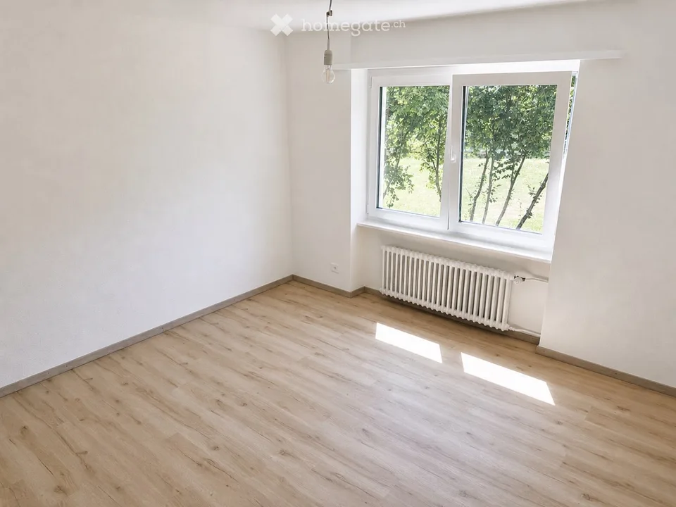 Appartement de 4,5 pièces avec balcon et jardin privatif