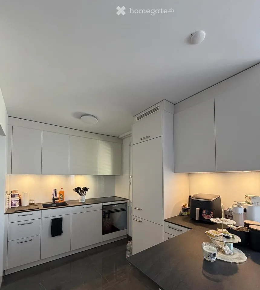 Bright 2.5-room apartment with balcony, distant view, and modern kitchen