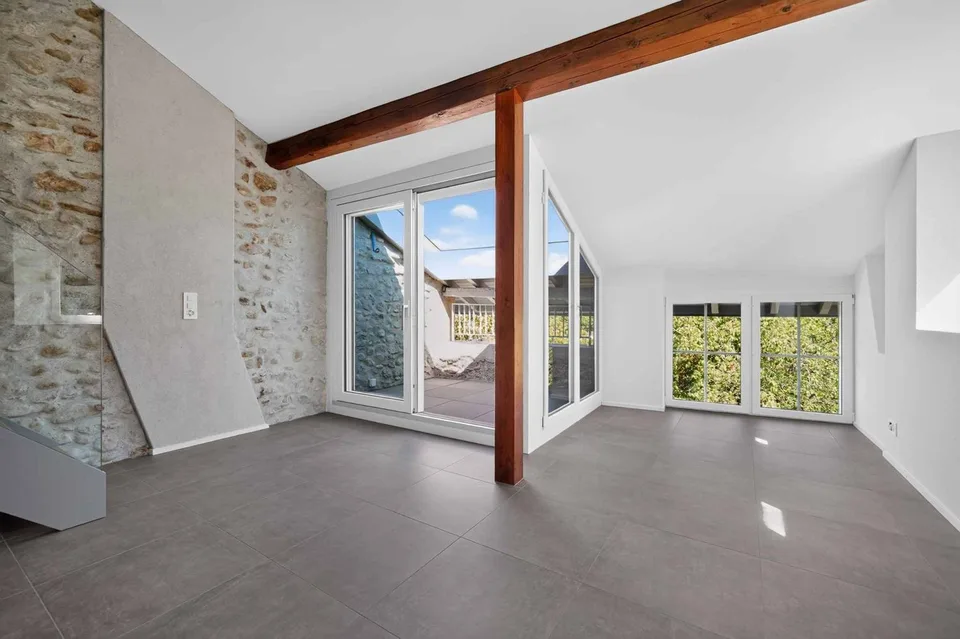Magnifico duplex con mezzanino e travi a vista