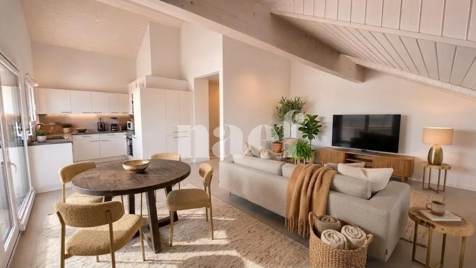 Bello appartamento di 4 locali nel sottotetto con ampio balcone e vista lago