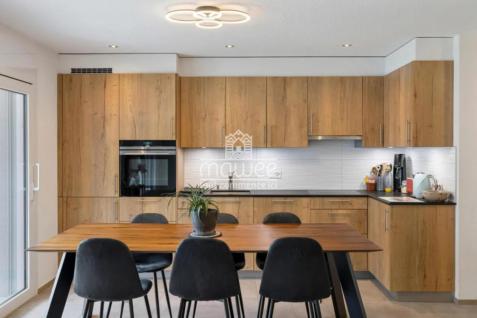 Charmantes 3,5-Zimmer-Wohnung mit Terrasse, Garten und zwei Parkplätzen