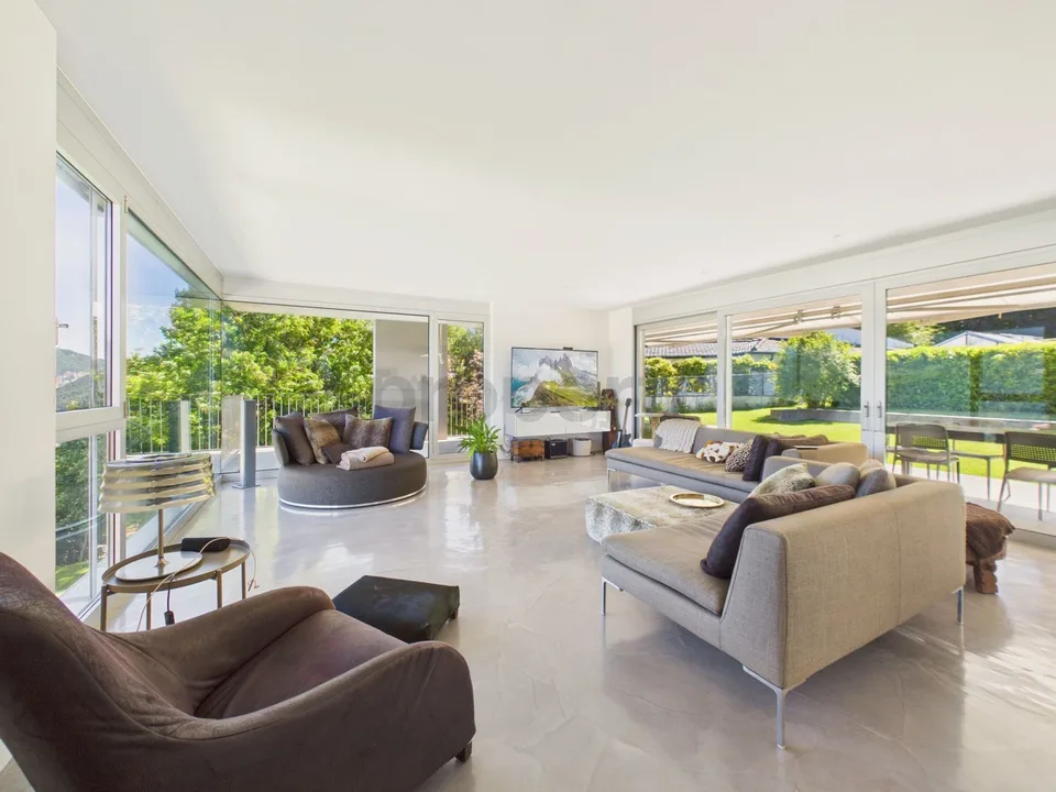 Elegant modern villa with garden and panoramic lake view in Carona