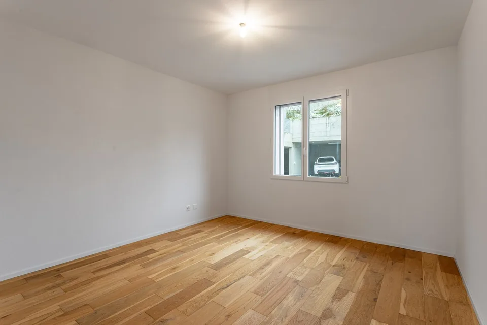 Neue 3.5-Zimmer-Wohnung im Erdgeschoss mit Terrasse und Garten in St-Aubin zum Verkauf