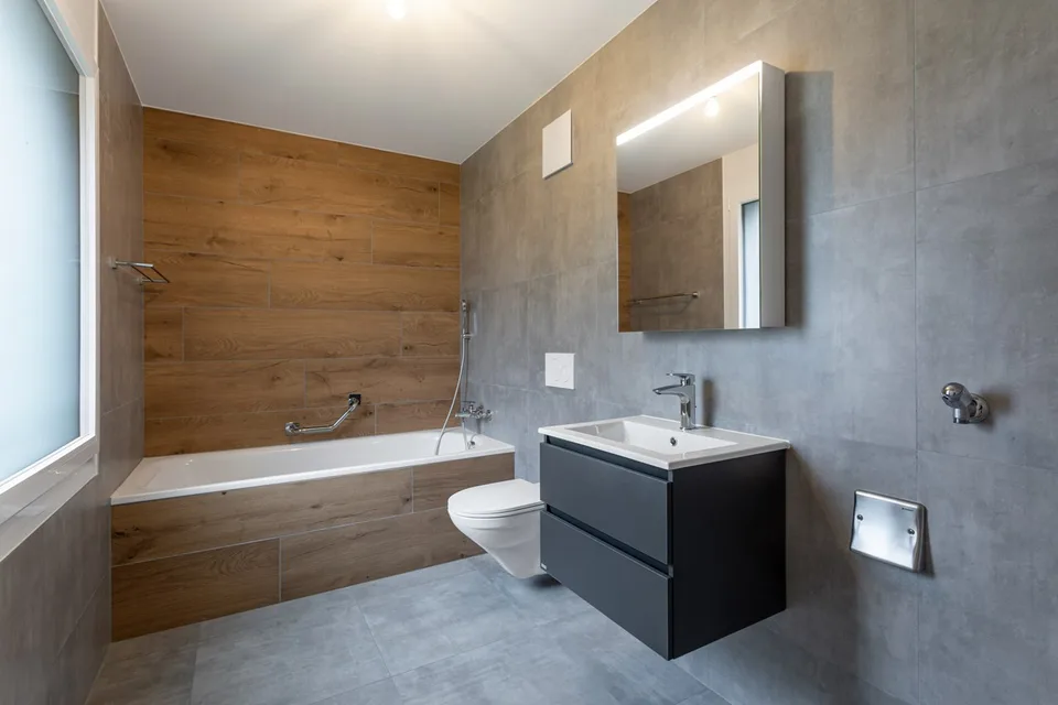 Neue 3.5-Zimmer-Wohnung im Erdgeschoss mit Terrasse und Garten in St-Aubin zum Verkauf