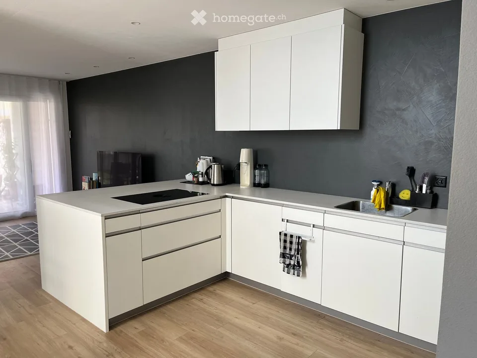 Casa a schiera moderna di 5,5 locali in un quartiere familiare