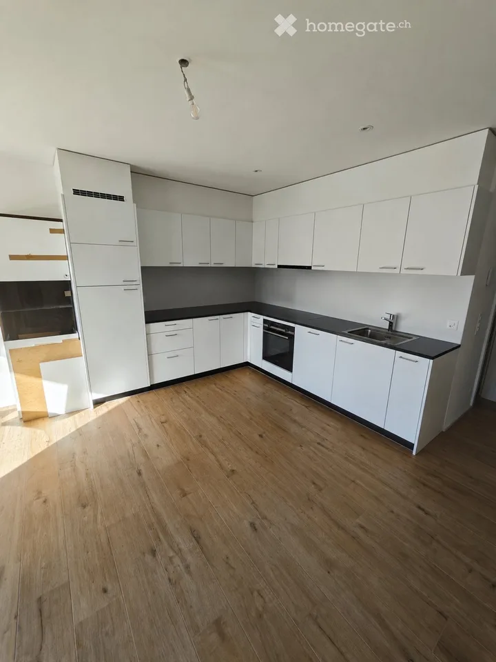 Appartement moderne de 2,5 avec terrasse et 2 places de parc