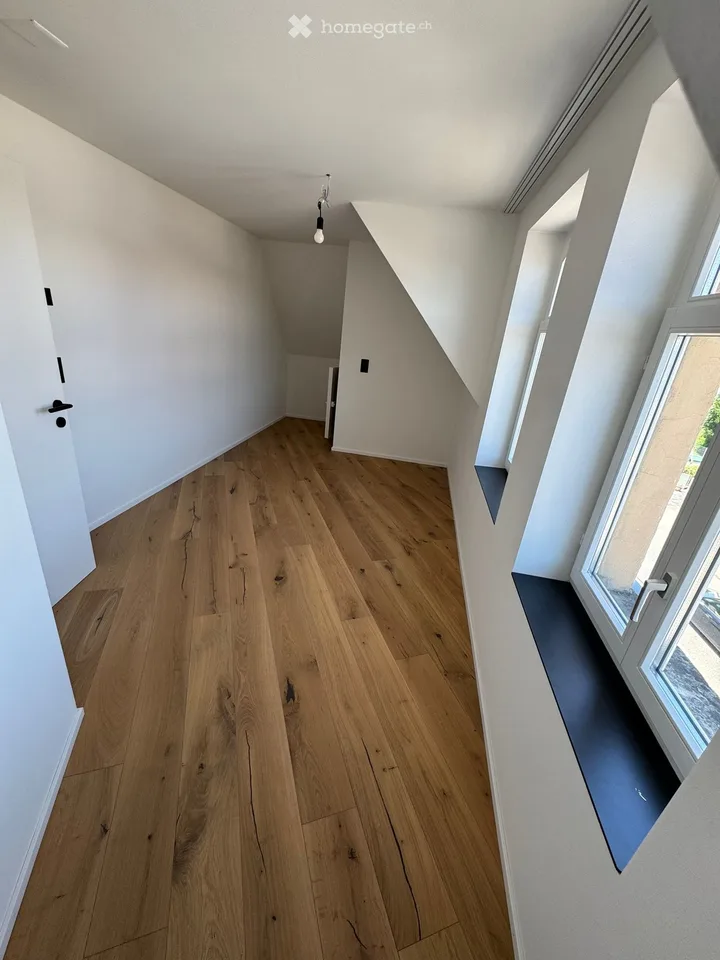 Appartamento mansardato di 4,5 locali completamente ristrutturato con balcone