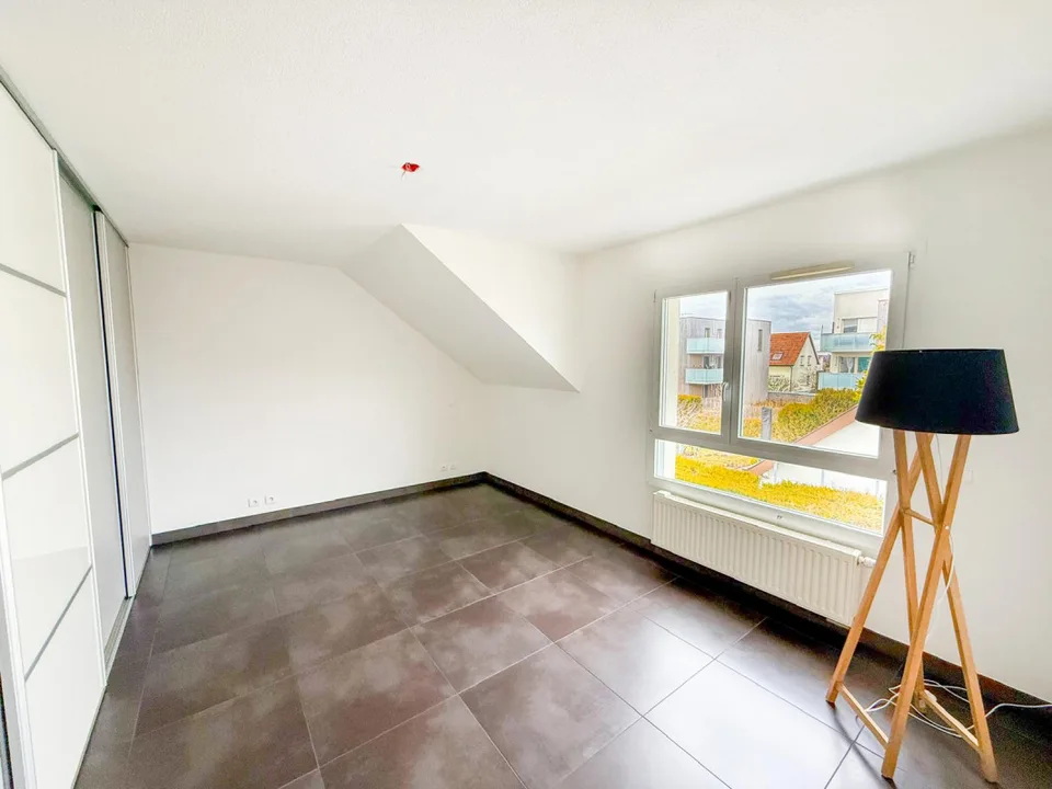 In France, Village-Neuf: The 4-Piece Premium Apartment with Unique Features