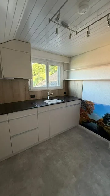 Incantevole appartamento mansardato di 4 locali con vista mozzafiato sul lago e le montagne a Oberhofen am Thunersee