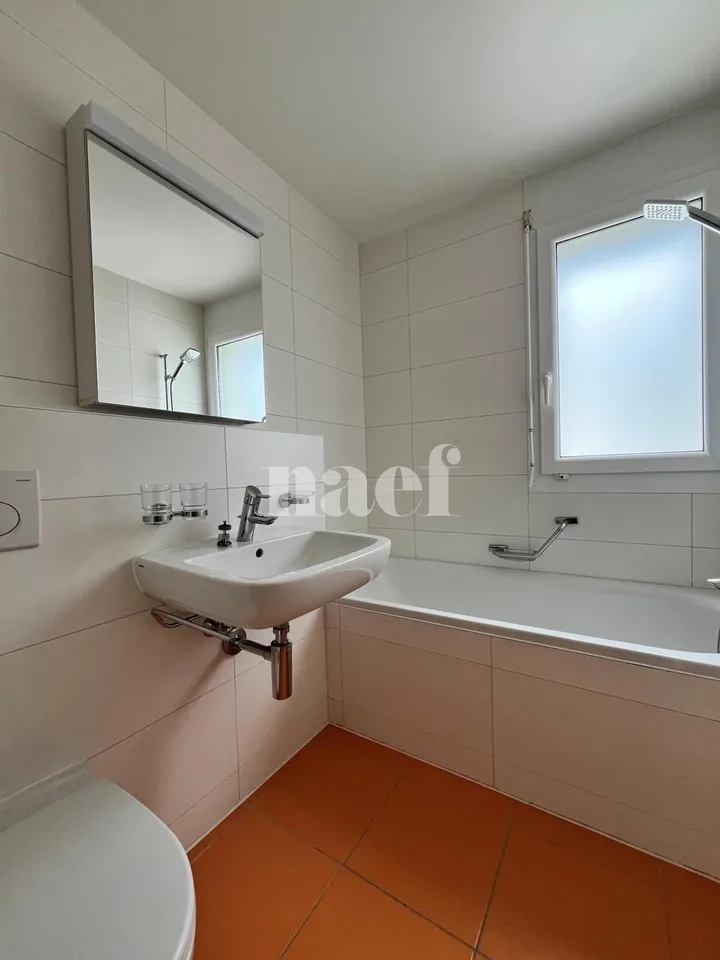 In a residential area, two steps from shops and school