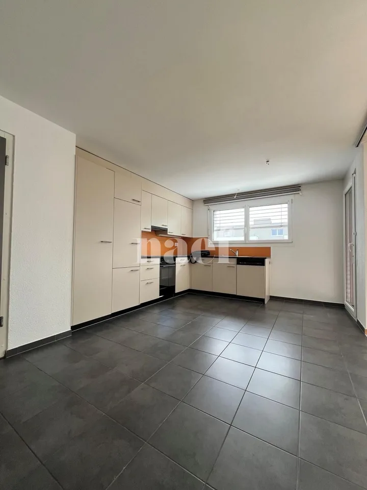 In a residential area, two steps from shops and school