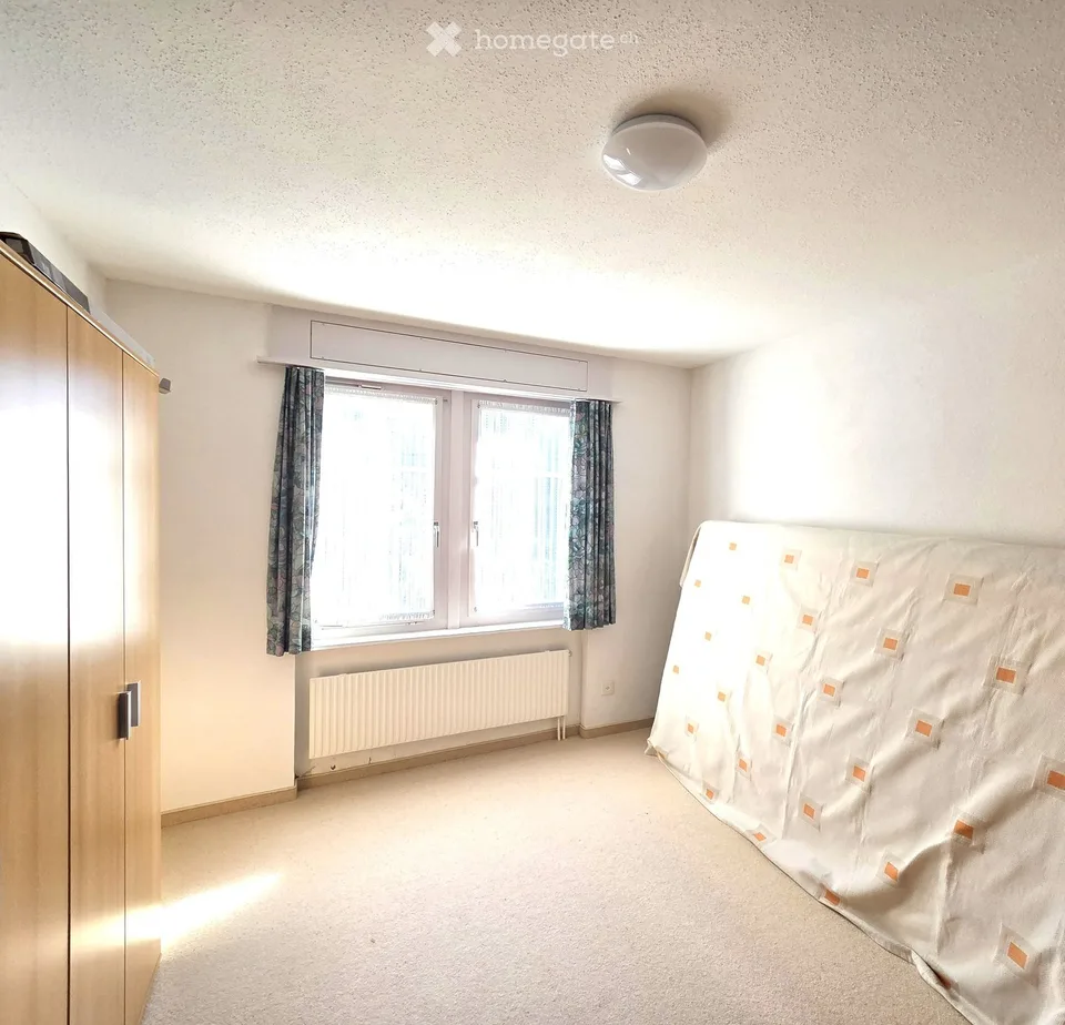 Incantevole appartamento di 2,5 locali con posto giardino, garage singolo e vista montagna a Wildhaus
