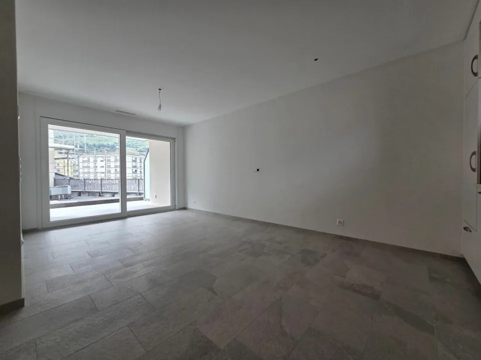 Neuf - Appartement de 2.5 pièces avec balcon et place de parc
