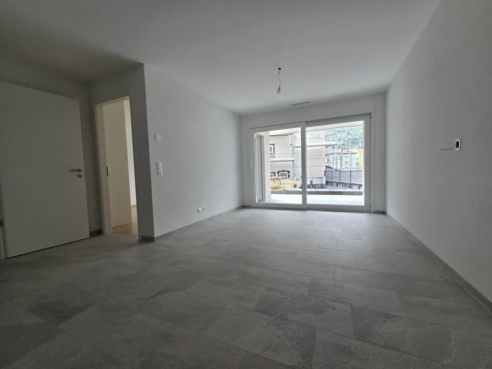 Neuf - Appartement de 2.5 pièces avec balcon et place de parc