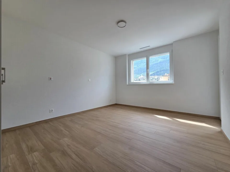 Nuovo - Appartamento di 3.5 locali con balcone e posti auto