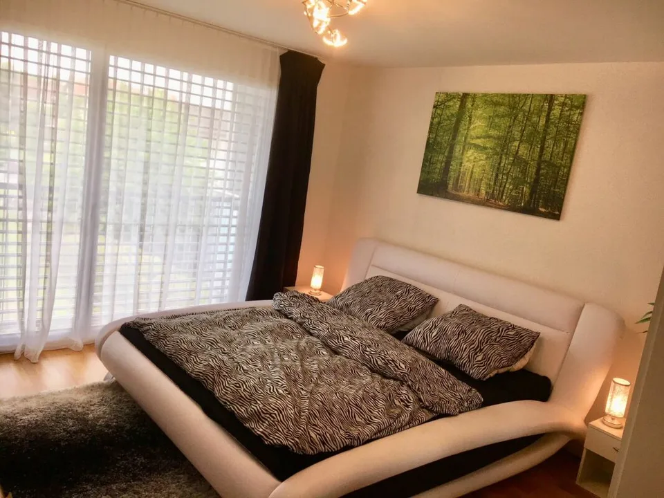 Appartement de jardin moderne 3.5 pièces au centre du village
