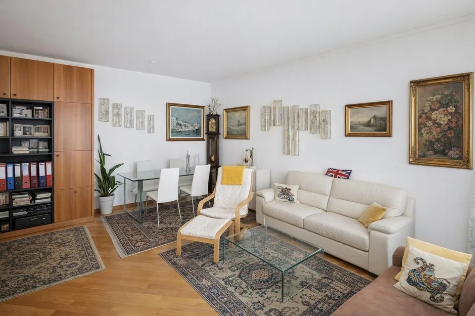 Refined 3.5-room apartment with covered terrace and premium finishes.