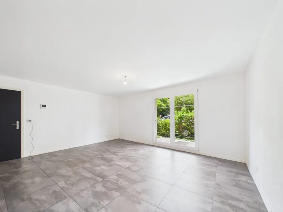 Appartement de 2.5 pièces au RDC avec jardin à Villeneuve