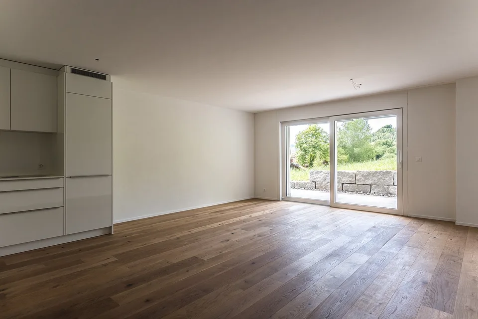 Modern 3.5-room apartment in Oberhelfenschwil – New building with seating area and magnificent view