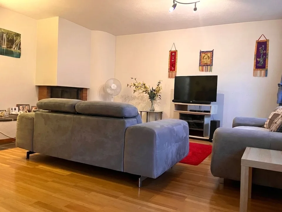 80 m² garden apartment with chimney - just a few steps from the train station