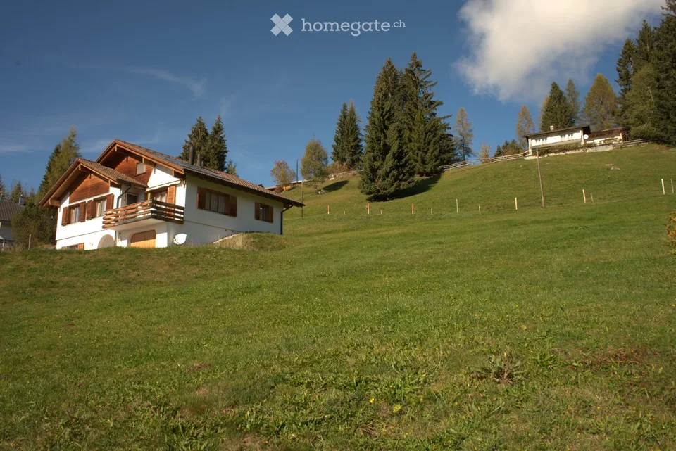 Building land with single-family house and panoramic view in Pany, Grisons