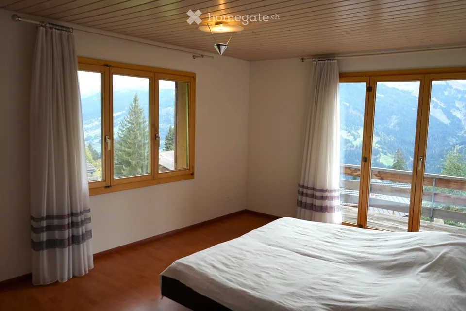 Building land with single-family house and panoramic view in Pany, Grisons