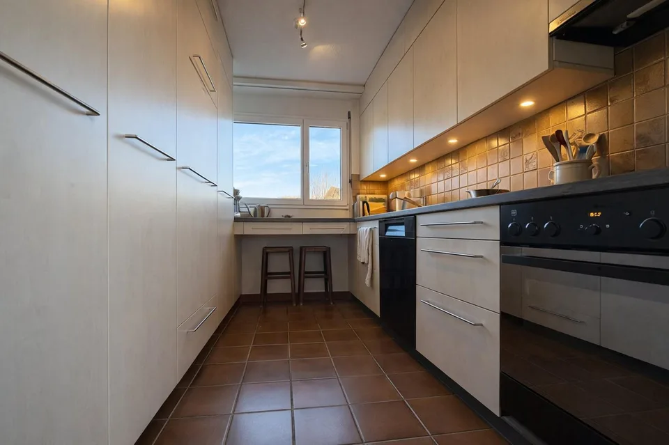 Family-friendly semi-detached house with winter garden and beautiful views in Hinteregg