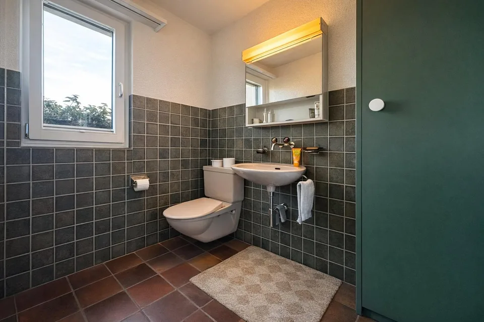 Family-friendly semi-detached house with winter garden and beautiful views in Hinteregg