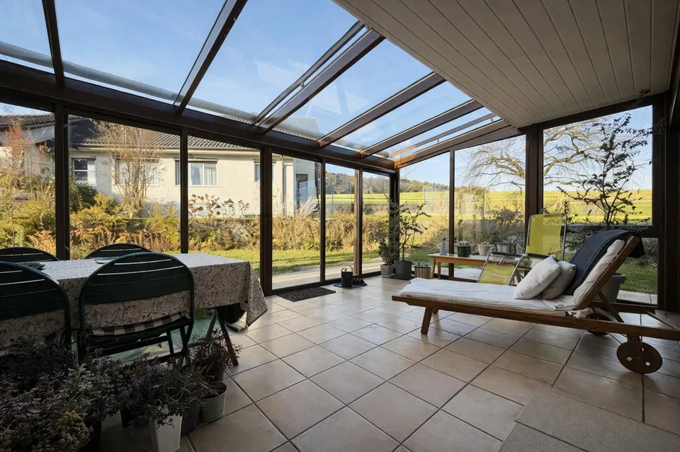 Family-friendly semi-detached house with winter garden and beautiful views in Hinteregg