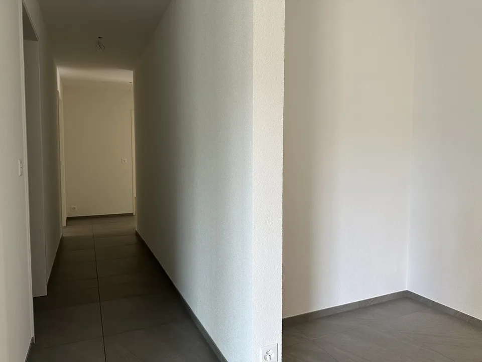 Nouvelle construction : appartement calme en centre-ville avec balcon