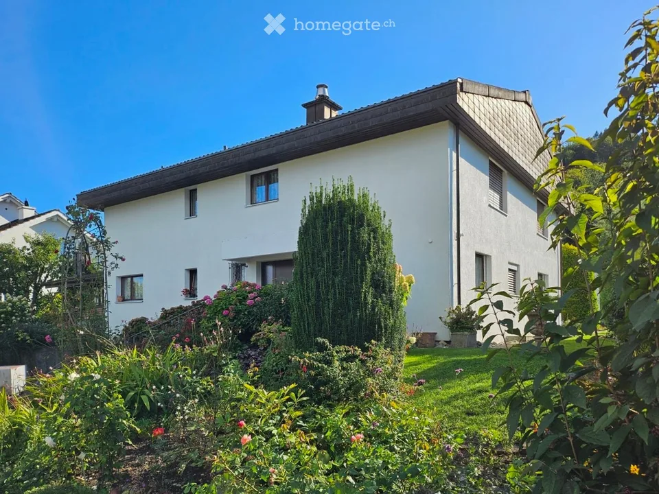 Attractive 7.5-room house with annex and building land