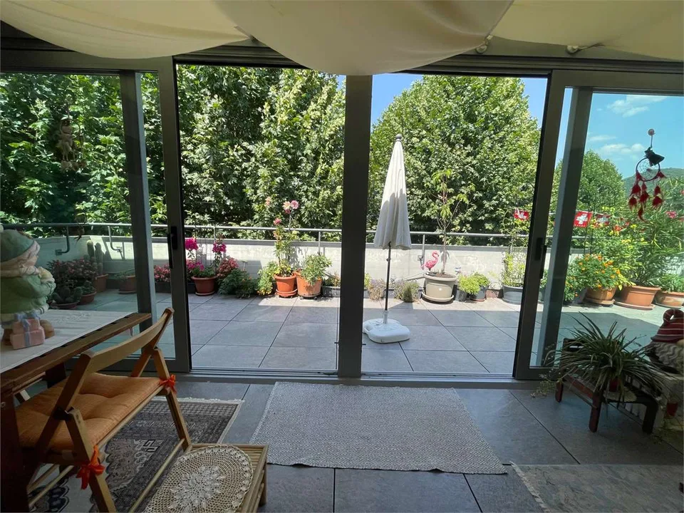Elegante Attico 3.5 locali con Giardino d'Inverno e terrazza, Agno