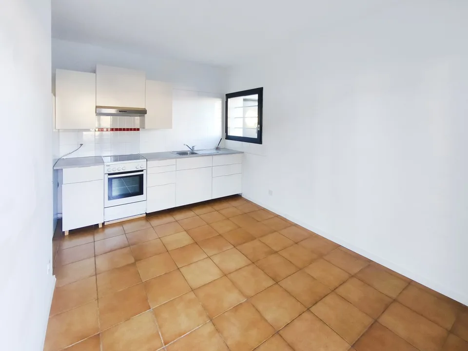 Intéressante maison bifamiliale de deux 3,5 pièces avec jardin à proximité du centre