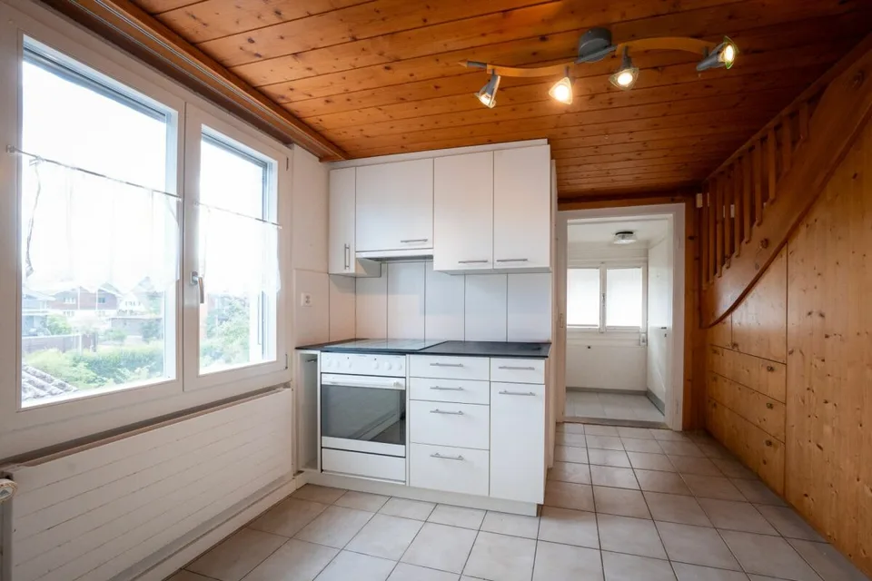 Two-family house with garages, workshop, and storage rooms for sale