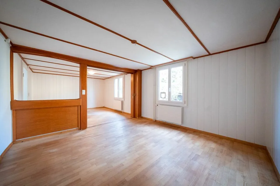 Two-family house with garages, workshop, and storage rooms for sale