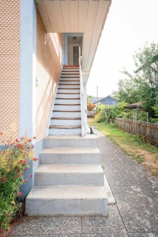 Two-family house with garages, workshop, and storage rooms for sale