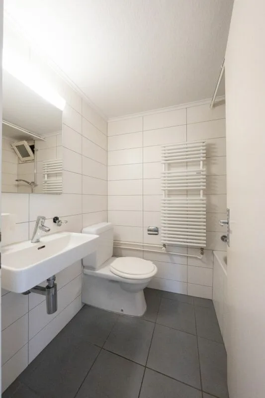 Two-family house with garages, workshop, and storage rooms for sale