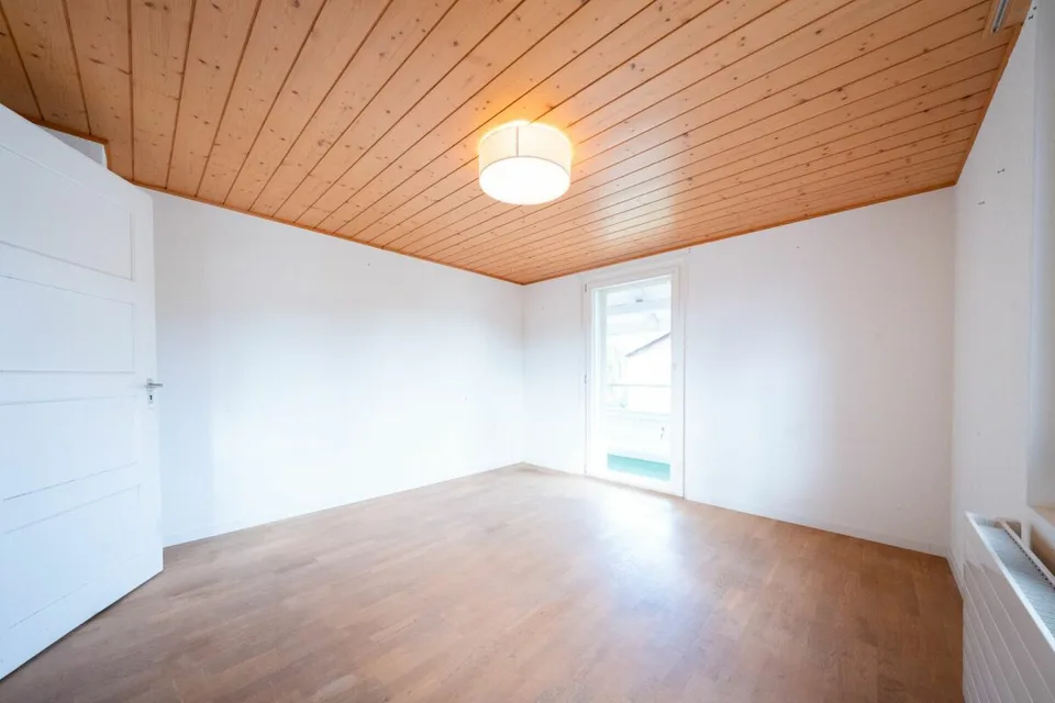 Two-family house with garages, workshop, and storage rooms for sale