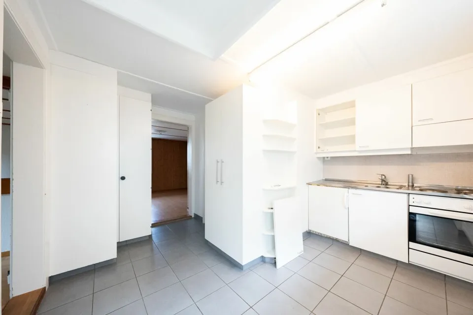 Two-family house with garages, workshop, and storage rooms for sale