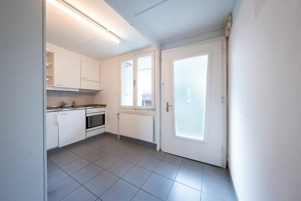 Two-family house with garages, workshop, and storage rooms for sale