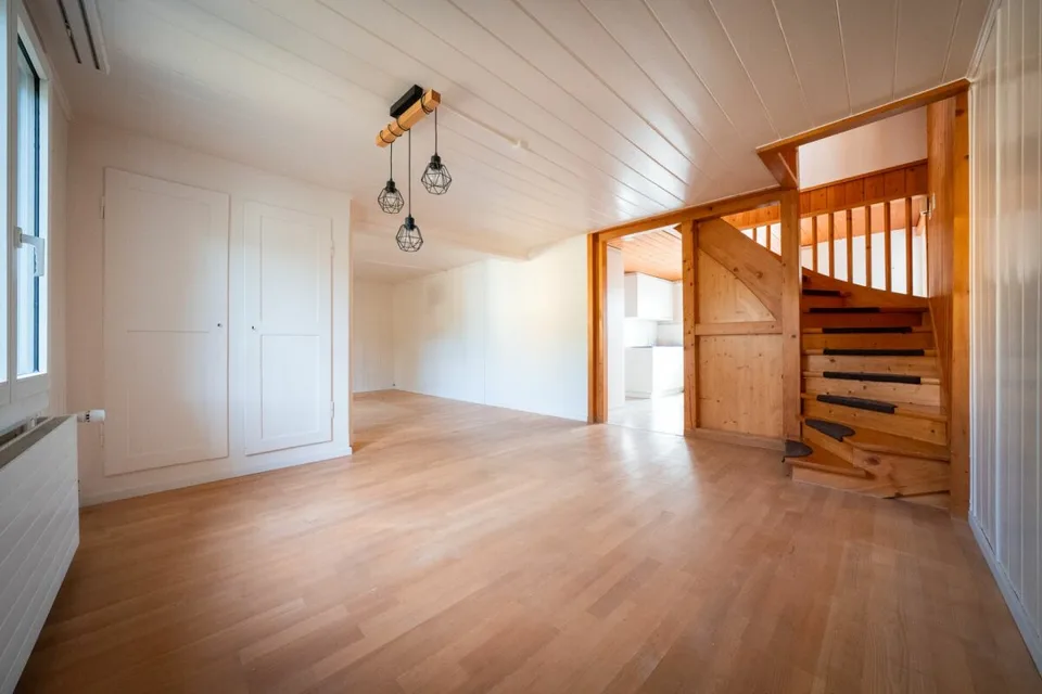Two-family house with garages, workshop, and storage rooms for sale
