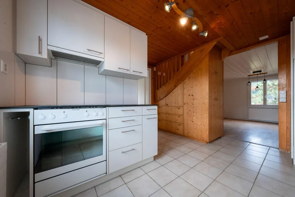 Two-family house with garages, workshop, and storage rooms for sale