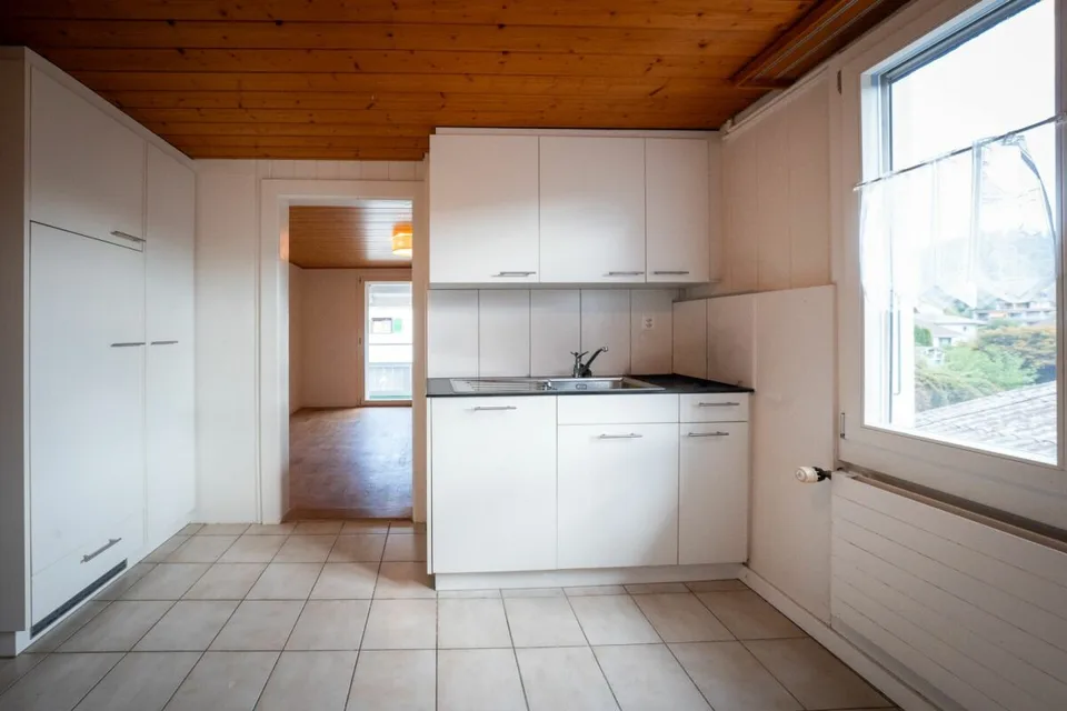 Two-family house with garages, workshop, and storage rooms for sale