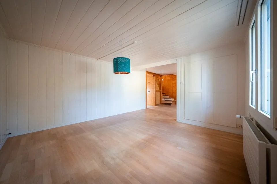 Two-family house with garages, workshop, and storage rooms for sale