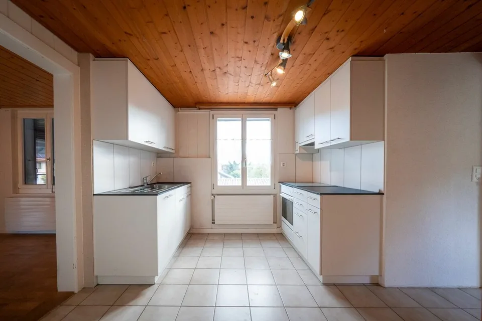 Two-family house with garages, workshop, and storage rooms for sale