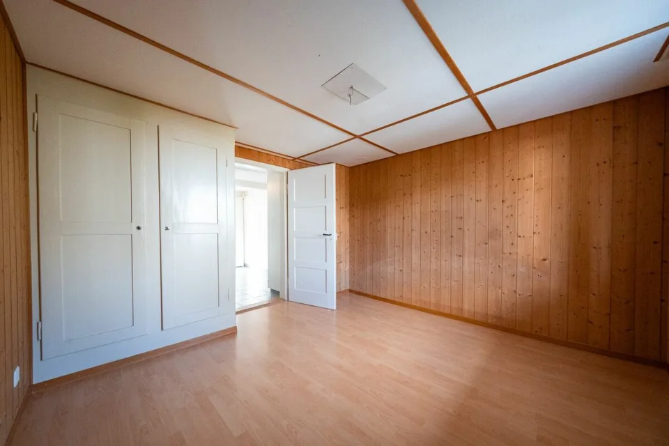Two-family house with garages, workshop, and storage rooms for sale