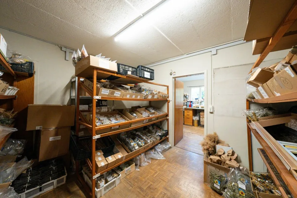 Two-family house with garages, workshop, and storage rooms for sale